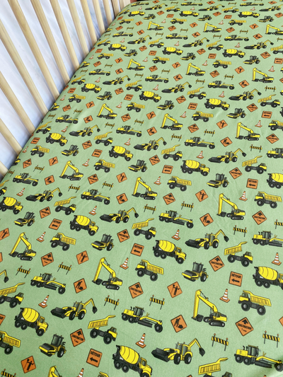 Fitted cotton sheet for bassinet : Construction Trucks (Sage Green Background)