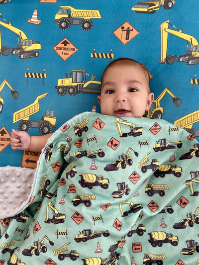 Fitted cotton sheet for bassinet : Construction Trucks (Teal Background)