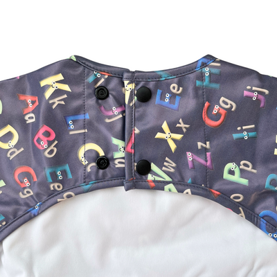 Waterproof long-sleeve bib with pocket: The friendly alphabets