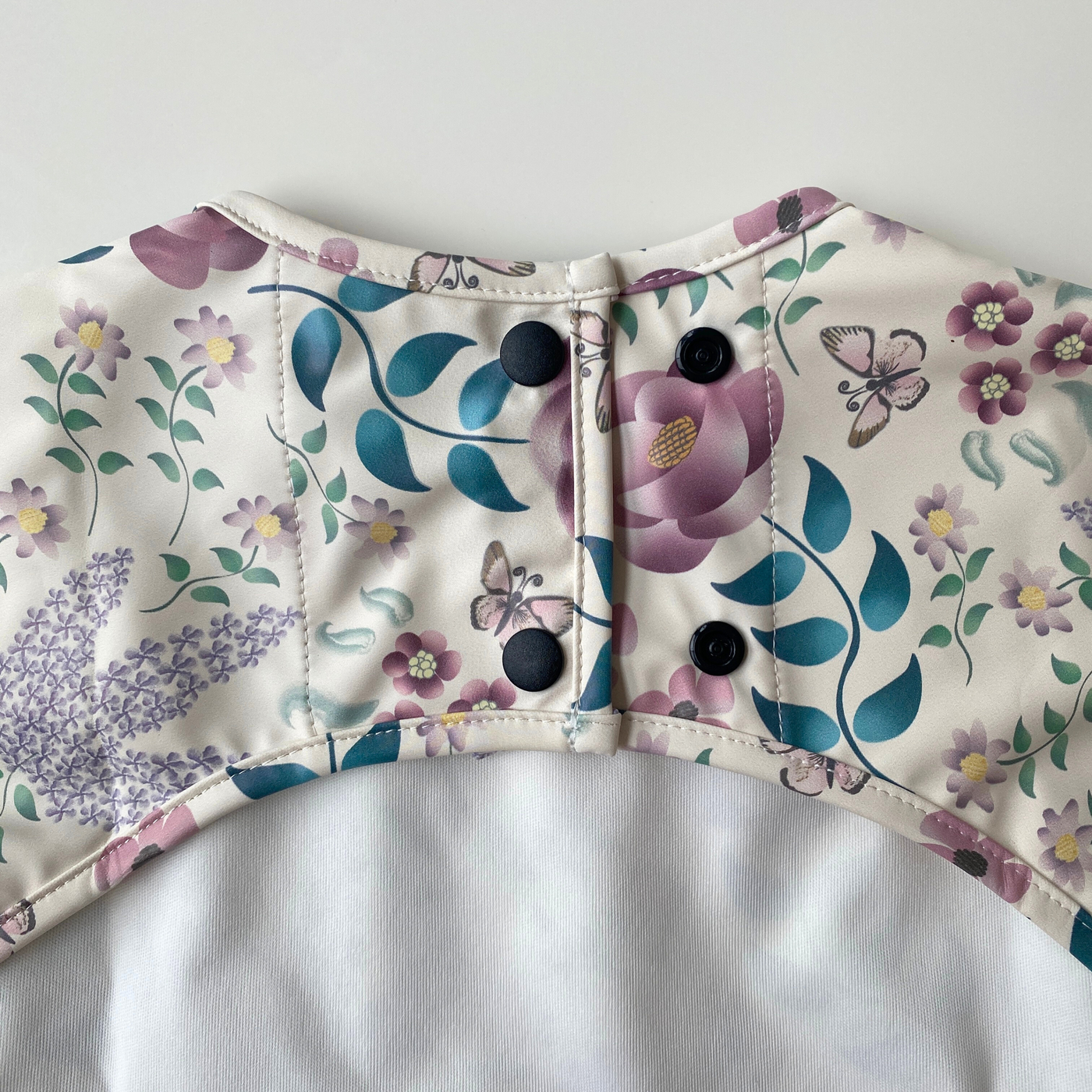 Long sleeve waterproof bib with pocket: Layla's Garden