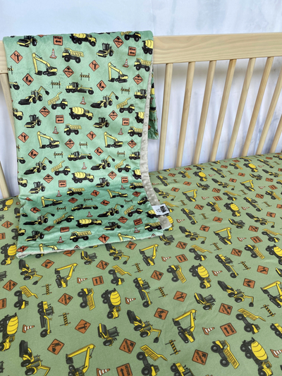 Fitted cotton sheet for bassinet : Construction Trucks (Sage Green Background)